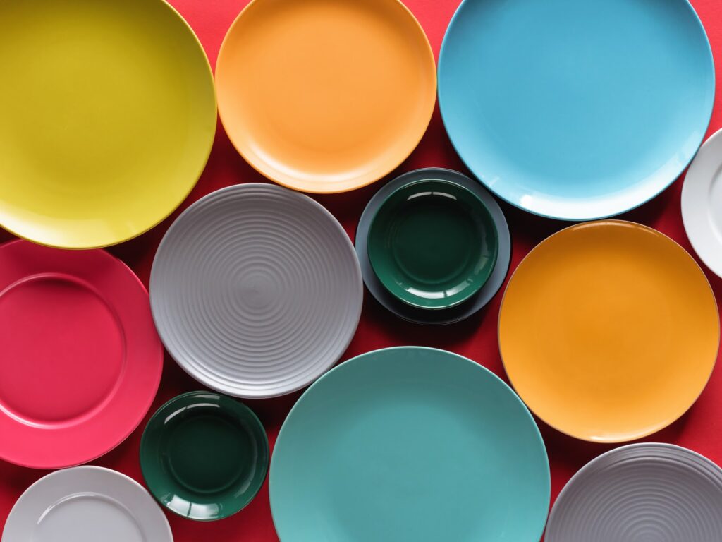 colorful plates sitting on a red table