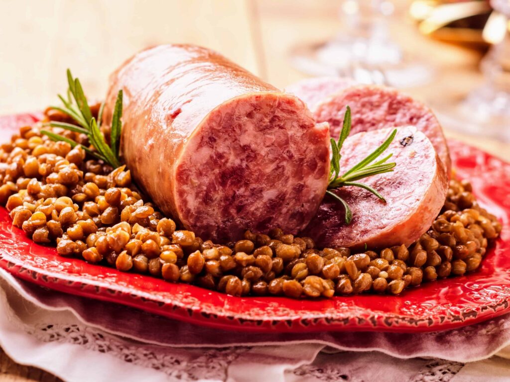 Cotechino on lentils, a traditional New Year's dish in Italy.