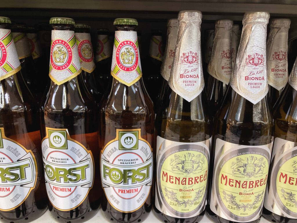 Forst and Menabrea beers on sale at a grocery store in Italy.