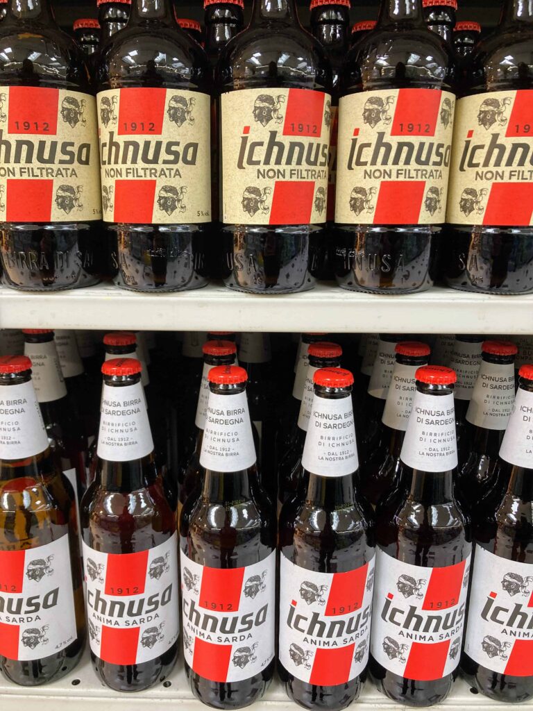 Ichnusa beers on display at an Italian grocery store.