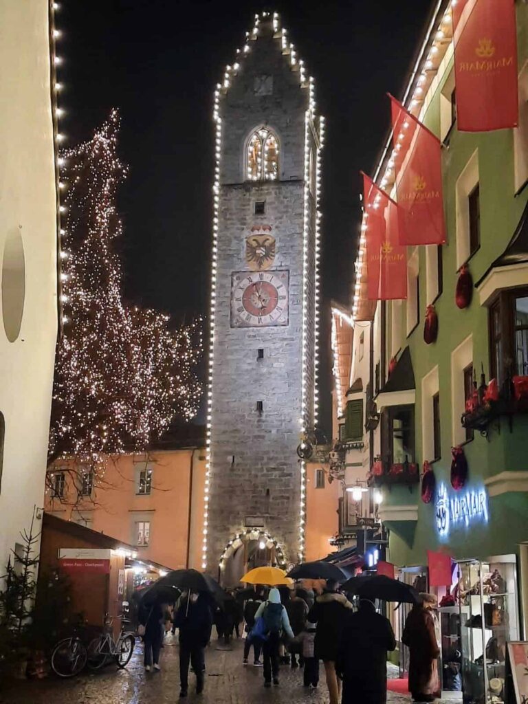 Lights and a Christmas market decorate the streets of a town in Northern Italy.