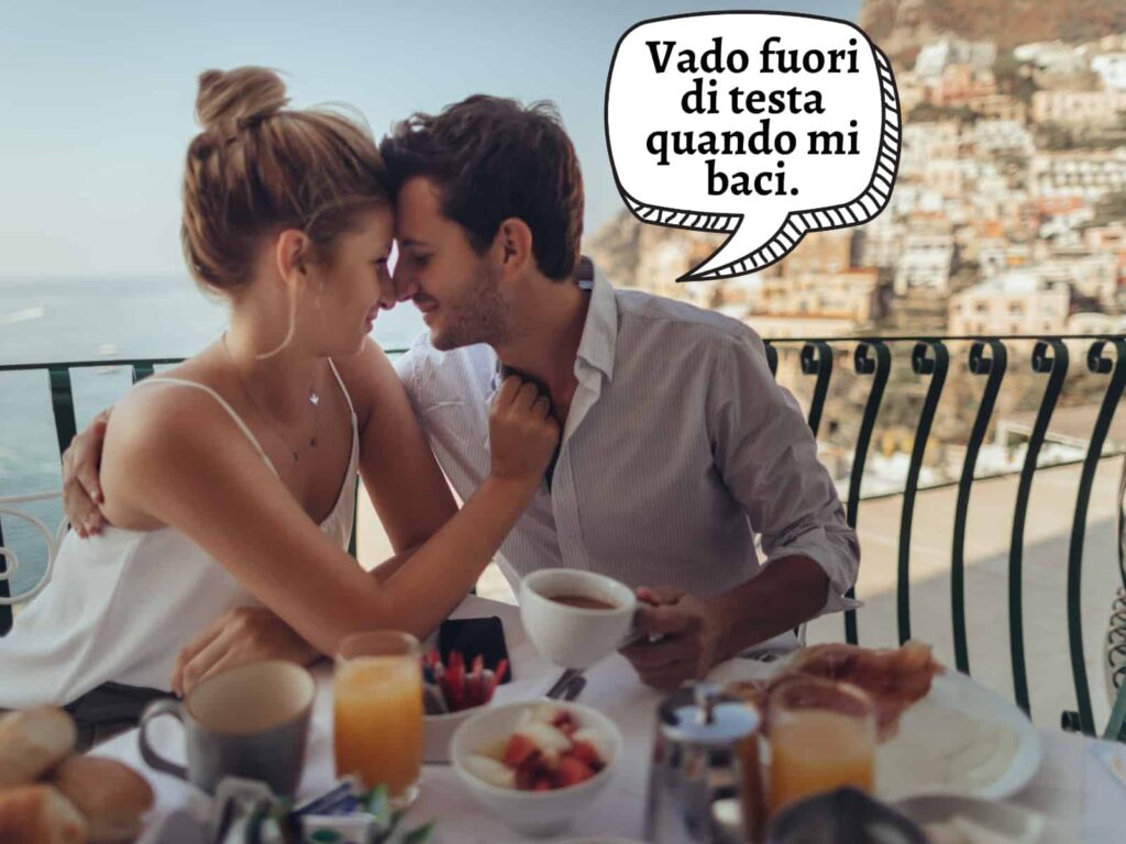 Couple kissing at breakfast on the Amalfi Coast. Graphic speech bubble says he goes crazy when she kisses him.