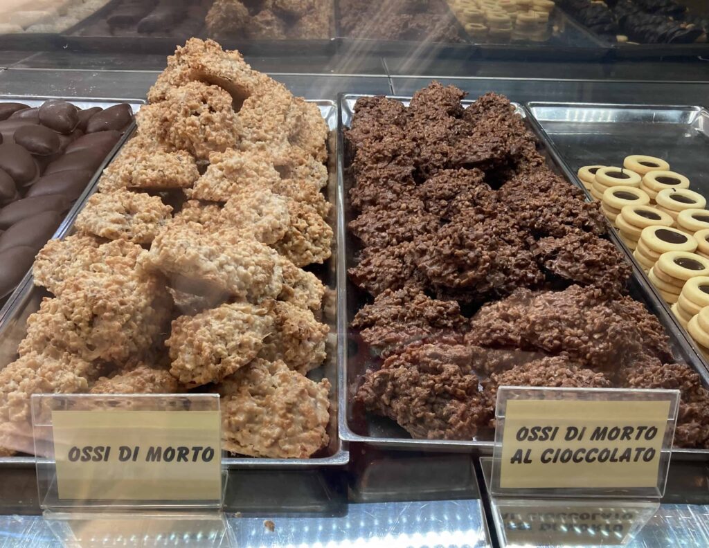 Ossi di morto cookies on display in a shop in Italy.