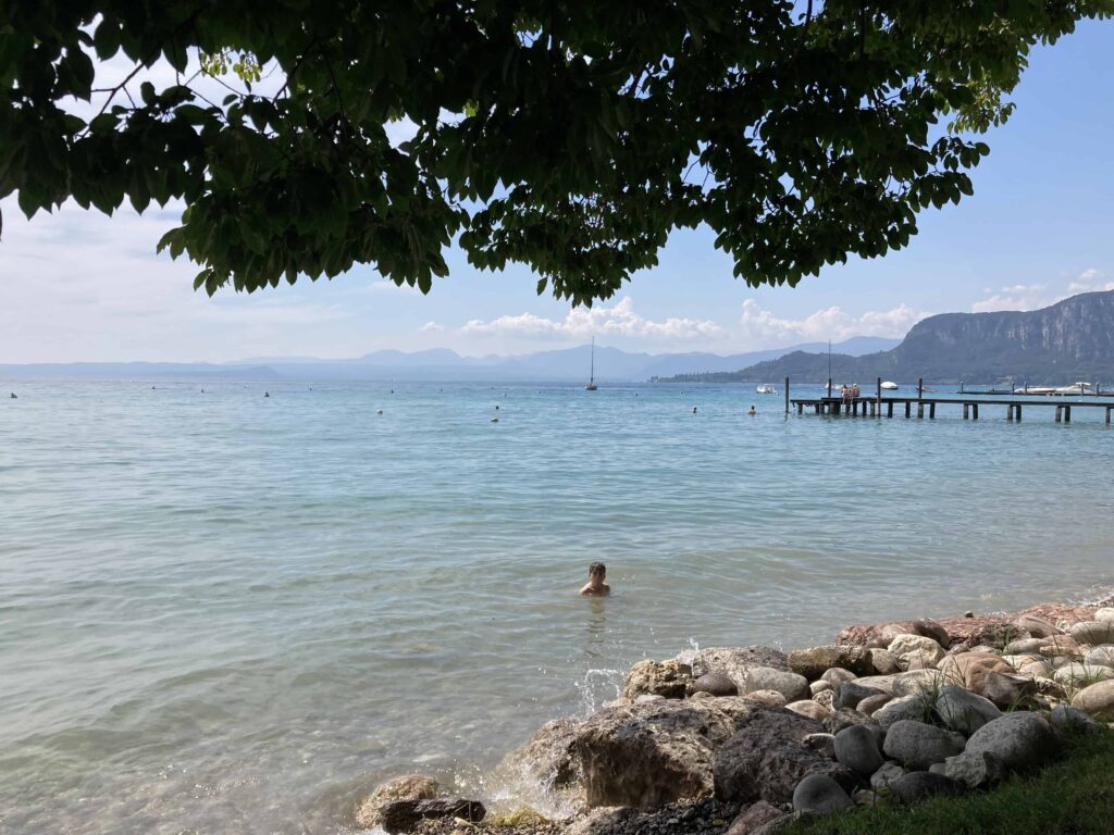 Boy swimming in Lake Garda.