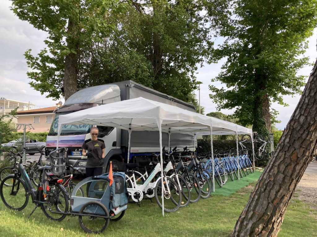 Tent with bicycles underneath.