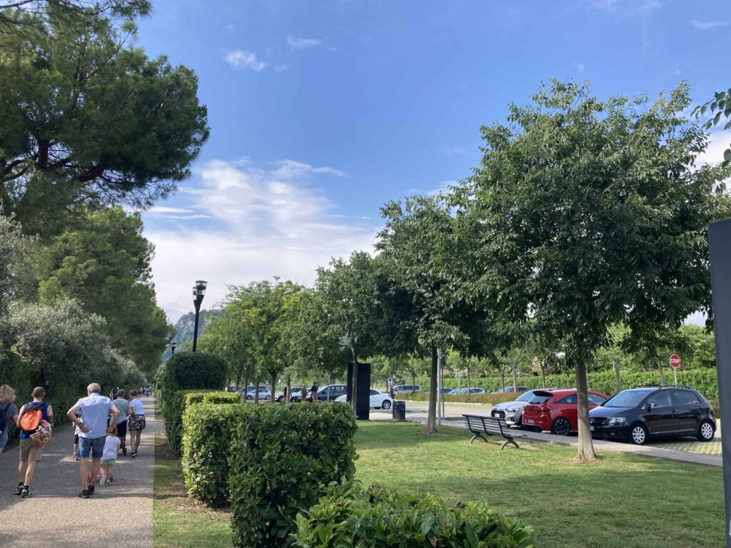 Park and walkway in Bardolino on Lake Garda. Trees on either side.