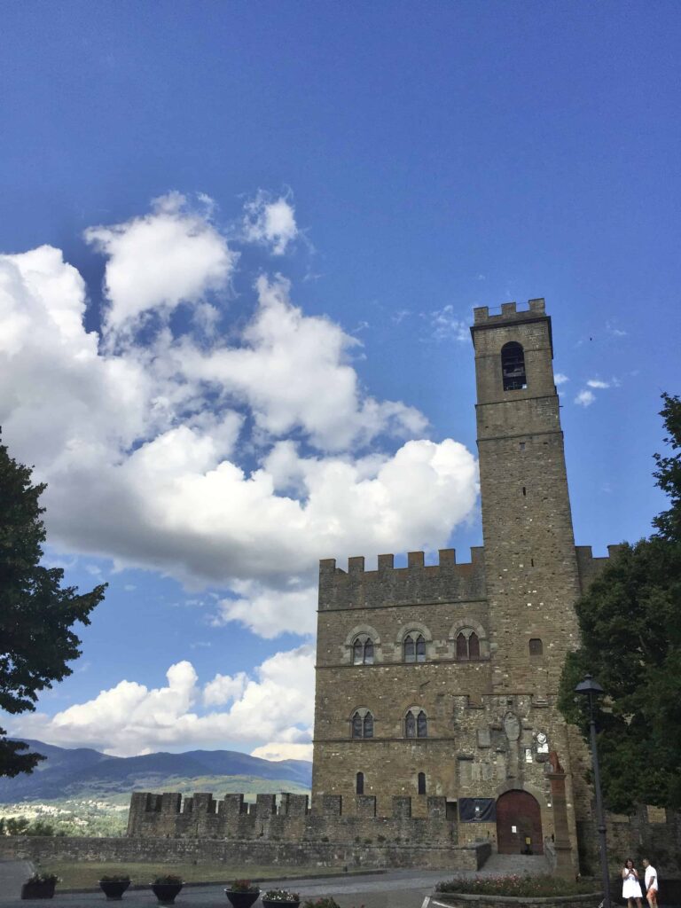 View of tower and Castello di Poppi in Tuscany on a sunny day.