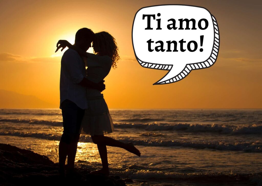 Couple hugging on beach at sunset and one says 'ti amo tanto!'