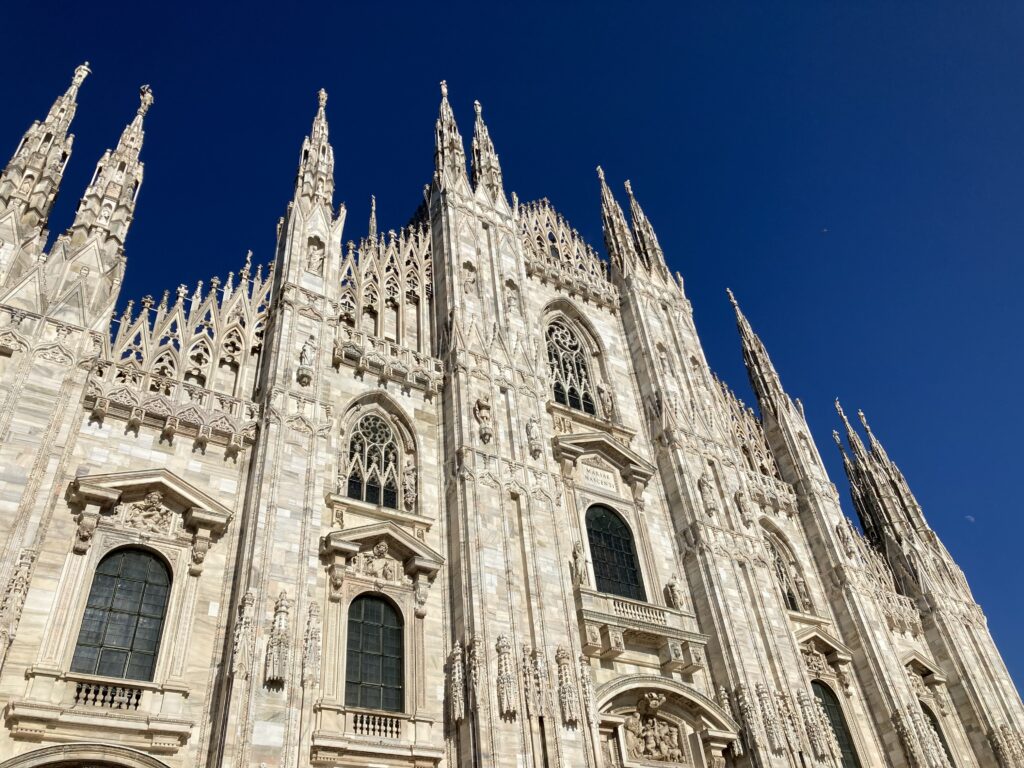 View of facade of Duomo in Milan, Italy.