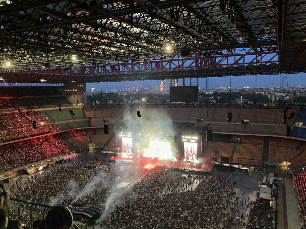View of the stage at a concert in San Siro Stadium in Milan from the upper stands.