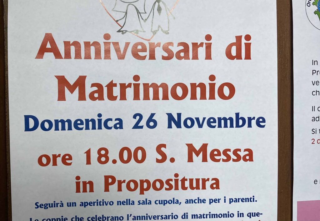 Sign in Italian for someone's wedding anniversary. It lists the date, time and place for the celebration.
