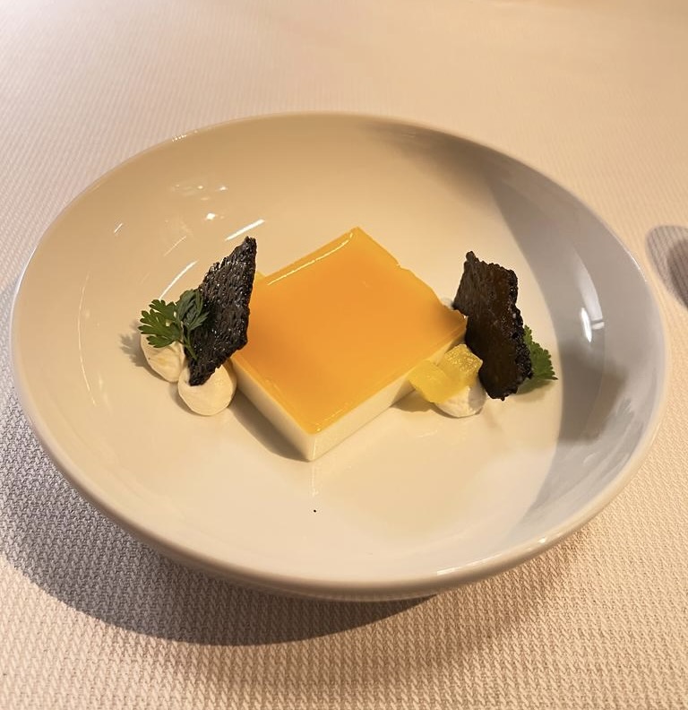 White plate with jelly dish and garnishes.